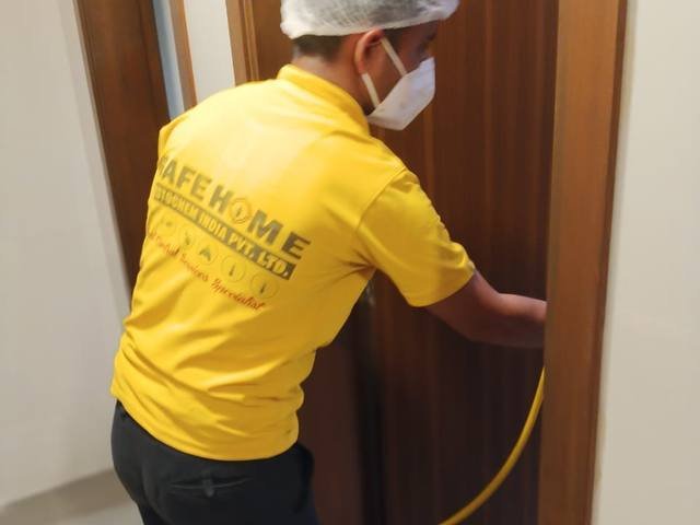 Treating guest room doors along a hotel corridor