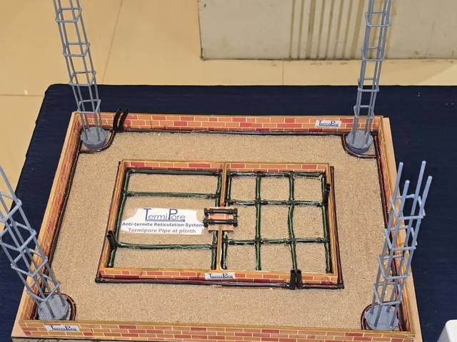 Demonstration model showing porous pipe installed around a building foundation